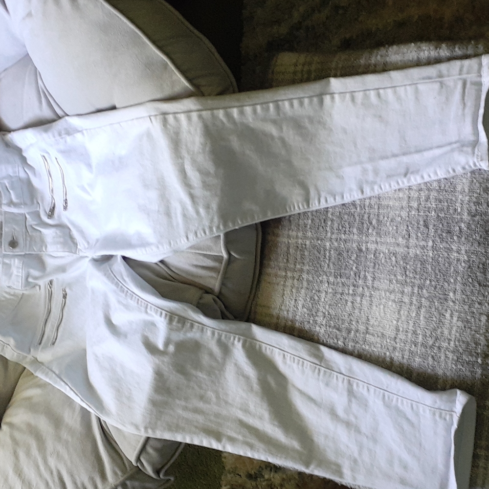 A pair of white gently worn size 12 high rise skinny jeans